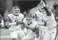  ?? NWA Democrat-Gazette/Ben Goff ?? STRONG WEAK: Senior Arkansas weakside linebacker Dre Greenlaw, center, celebrates with teammates Saturday after intercepti­ng a pass during a 24-17 loss to Texas A&amp;M in the annual Southwest Classic at the Dallas Cowboys’ AT&amp;T Stadium in Arlington, Texas.