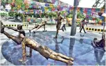  ??  ?? A traffic island themed on the importance of physical exercise set up at a cost of Rs 14 lakh in Tiruchy that was inaugurate­d on Saturday