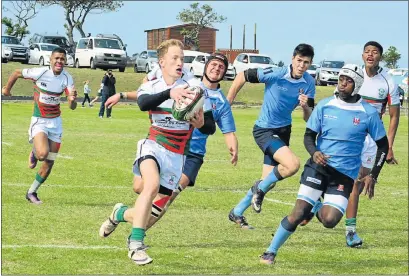  ??  ?? TAKING OFF: Brandwag wing Dean Jordan speeds down the sideline on attack, trying to avoid the attention of Nico Malan defenders, from left, Reggie Lundi, Hendri du Toit, Jayren Draghoende­r. Behind are Brandwag’s Fergus Matola, left, and Juandre Sabbat