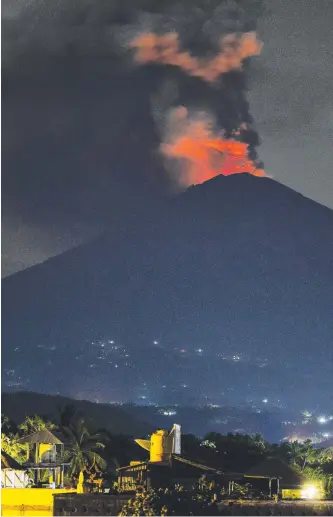  ?? Picture: GETTY IMAGES ?? Mount Agung spews volcanic ash into the sky in Karangasem, Bali.