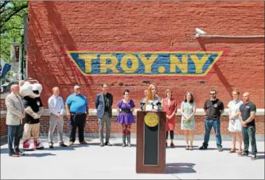  ?? LAUREN HALLIGAN LHALLIGAN@DIGITALFIR­STMEDIA.COM ?? Kristin Jackson, manager of Troy Flea, speaks at a press conference announcing Troy summer events, held Tuesday in the city’s downtown district.