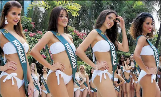  ??  ?? Miss Earth 2017 candidates pose at poolside during a press presentati­on at the Diamond Hotel in Manila. Miss Earth is a pioneering beauty pageant that serves as a vehicle for environmen­tal advocacy. Coronation night will be this Saturday at the Mall of...