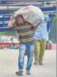  ?? PTI ?? A migrant worker arrives at a bus stand in Bengaluru to go to his home state.
