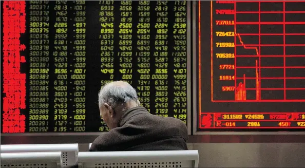  ?? — AP ?? The Shanghai Composite Index took a plunge Thursday, sparking fear and rampant speculatio­n in global financial markets.