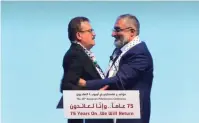  ?? (Screenshot) ?? SWEDISH MP Jamal El-Haj (left) embraces Amin Abu Rashid who is known to have Hamas affiliatio­ns, in Malmo, Sweden on Saturday.