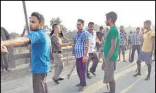  ?? ANI ?? Protesters during a clash between tribal and non-tribal groups at Ichamati village in Meghalaya on Friday.