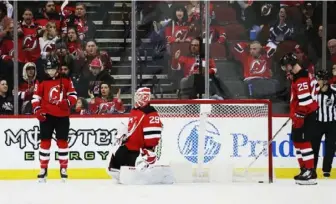  ?? Bruce Bennett/Getty Images ?? Damon Severson, left, tapped a puck into his own net costing the New Jersey Devils an overtime loss to the Toronto Maple Leafs Friday in Newark, New Jersey.