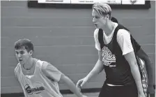  ?? STAFF PHOTO BY DAVID COBB ?? Tennessee freshman Zach Kent, right, plays in a Rocky Top League game at Knoxville Catholic High School last week. Kent enrolled at Tennessee earlier this month.