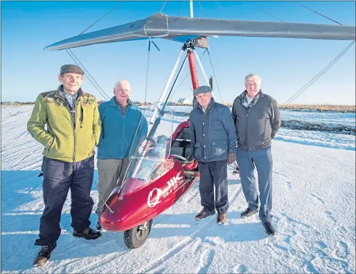  ??  ?? Pilots Jim Bolton, 78, Bob Shewan, 80, Alfie Thomson and Peter Bailey, both 81, with a microlight at Longside Airfield near Peterhead