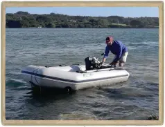  ??  ?? James with the dinghy, in the good old days, when the tender still had a bottom.