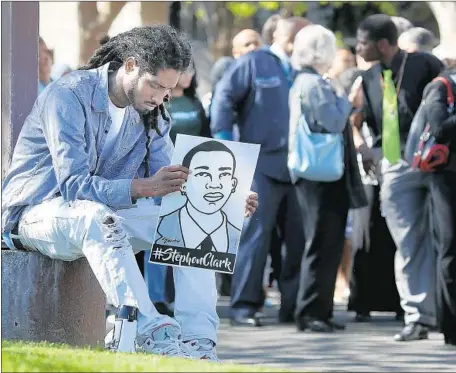  ?? Justin Sullivan Getty Images ?? HUNDREDS of people, including Steven Ash, left, attended Thursday’s funeral for Stephon Clark, who was killed by Sacramento police.