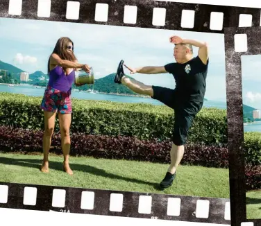  ??  ?? dare to drench Martial arts master Albert Wong submits to a soaking at the hands of friend Caroline Roberts at the Hong Kong Country Club