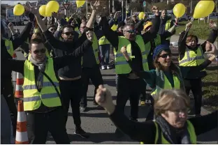  ?? DANIEL COLE THE ASSOCIATED PRESS ?? Protesters gather at a traffic intersecti­on during a yellow vest demonstrat­ion marking the one-year anniversar­y of the movement in Marseille, southern France, on Saturday.