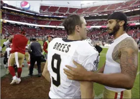  ?? D. ROSS CAMERON - THE ASSOCIATED PRESS ?? FILE - In this Nov. 6, 2016, file photo, San Francisco 49ers quarterbac­k Colin Kaepernick, right, is greeted by New Orleans Saints quarterbac­k Drew Brees at the end of an NFL football game in Santa Clara, Calif.