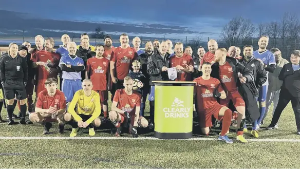  ?? ?? Northumbri­a Police and Swan Lodge teams who took part in the charity match.