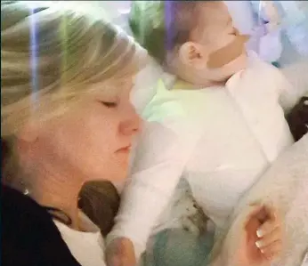  ??  ?? Sleeping peacefully: Charlie Gard and his mother Connie in hospital yesterday