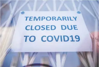  ?? TOLGA AKMEN / GETTY IMAGES / AFP ?? In the early days of the COVID-19 pandemic, employees were optimistic, expecting to be shortly recalled to work. As it happened, many did not get recalled and became stuck in limbo.