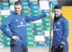  ??  ?? Look ahead: Oliver Norwood (right, pictured with Jonny Evans) says there are positive signs for the future of Northern Ireland