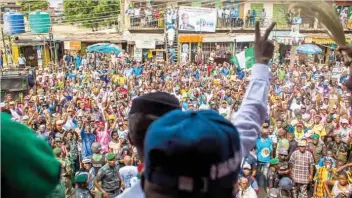  ??  ?? VP Osinbajo addresses residents of a community, during a campaign in Lagos.