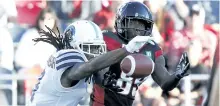  ?? PATRICK DOYLE/THE CANADIAN PRESS ?? Toronto Argonauts’ defensive back Akwasi Owusu-Ansah, left, knocks down a pass intended for Ottawa Redblacks’ wide receiver Dominique Rhymes during the first half of CFL football action in Ottawa, on Saturday.