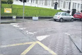  ?? (Photo: Katie Glavin) ?? Speed ramps on MacCurtain Street are ‘breaking up and chipping’. Holes have formed on either side of the ramp outside Bishop Murphy Memorial School, making it difficult for cars to navigate.