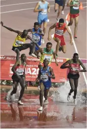  ??  ?? Avinash Sable (third row, in blue) of India competes in the men’s 3000 metre steeplecha­se heats at the World Athletics Championsh­ips in Doha, Qatar, on Tuesday. In the front row are Benjamin Kigen of Kenya, Hillary Bor of the United States and Benjamin Kiplagat of Uganda. — AP