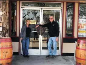  ?? COURTESY OF JULIANNA JETTE ?? Co-owners Julianna Jette, left, and Raleigh Morrow stand by the doors of their newest Village Coffee Shop at 700 E. Victor Road in Lodi.