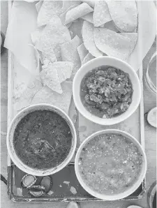  ?? ANGIE MOSIER/ RUX MARTIN BOOKS/HOUGHTON MIFFLIN HARCOURT ?? Eddie Hernandez makes a salsa fresca, or “fresh sauce,” pictured top right, that is piquant with jalapenos and onion.