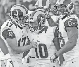  ?? Ryan Kang Associated Press ?? RAMS RECEIVER Pharoh Cooper (10), with quarterbac­k Case Keenum (17) and tight end Lance Kendricks, is aiming to score his first NFL touchdown this year.