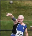  ??  ?? Tom McGrane in action in the shot putt.