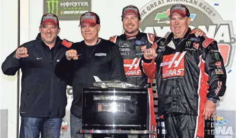  ?? JASEN VINLOVE, USA TODAY SPORTS ?? From left, team co-owners Tony Stewart and Gene Haas, driver Kurt Busch and crew chief Tony Gibson celebrate after Sunday’s Daytona 500 victory, the team’s first.