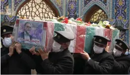  ??  ?? Mourning: Mr Fakhrizade­h’s coffin in a shrine in Mashhad