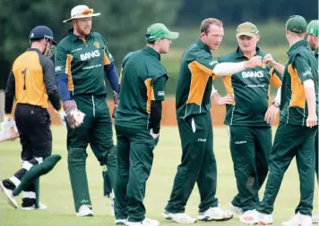  ??  ?? Northumber­land celebrate taking the wicket of Staffordsh­ire captain Alex Mellor.