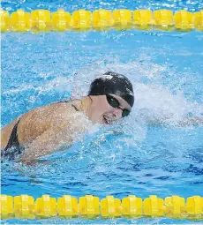  ?? LAURENCE GRIFFITHS/GETTY IMAGES ?? Katie Ledecky competes during the women’s 400-metre freestyle final during the FINA world championsh­ips on Sunday in Budapest, Hungary. Ledecky won gold in the event.