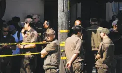  ?? Gabrielle Lurie / The Chronicle ?? UPS workers were evacuated from their Potrero Hill building during a rampage in which a driver killed three colleagues, then himself.
