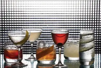  ?? DEB LINDSEY FOR THE WASHINGTON POST ?? The seven essential cocktails, according to a survey of bartenders, negroni (from left), martini, daiquiri, old-fashioned, Manhattan, margarita, and gin and tonic. They were made by bartender Andrea Tateosian at Urbana in Washington.