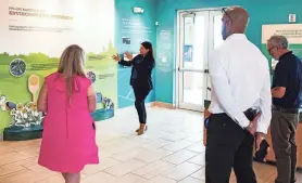  ?? PHOTOS BY ANDREW WEST/FORT MYERS NEWS-PRESS ?? Rachel Jackson, a communicat­ions specialist with Florida Power and Light, gives a tour of the new solar ranch building at Babcock Ranch. The new eco-discovery center is a family-friendly mini-museum of interactiv­e exhibits and games that amount to a crash course in the developmen­t’s electrical innovation­s.