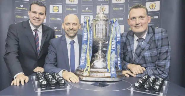  ??  ?? 0 Sky Sports’ Luke Shanley, former Hearts player Colin Cameron and former Scottish rugby player Doddie Weir made the William Hill Scottish Cup fourth round draw.