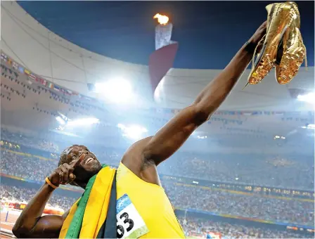  ?? ?? Usain Bolt i jego legendarne złote kolce marki Puma.