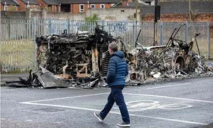  ?? Photograph: Paul Faith/AFP/Getty Images ?? The remains of a burnt-out bus on the loyalist Shankill Road in Belfast on Thursday.