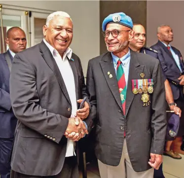  ?? Photo: DEPTFO News ?? Prime Minister Voreqe Bainimaram­a with former UN peacekeepe­r Sakaraia Vuli at the 40th Fiji-UN Anniversar­y Symposium at the Grand Pacific Hotel in Suva on June 15, 2018.