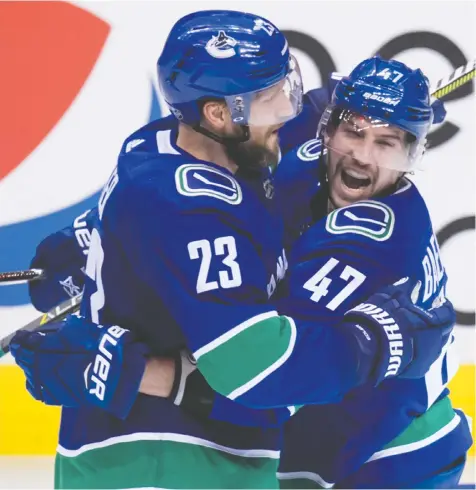  ?? PHOTOS: THE CANADIAN PRESS ?? Vancouver defenceman Alexander Edler, left, here with forward Sven Baertschi, is one of only three Canucks who were in the city earlier this week. Defencemen Troy Stecher and Chris Tanev were the others.