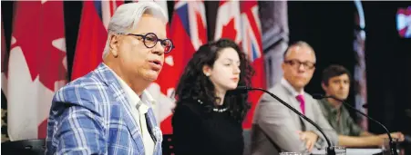  ?? MARK BLINCH, THE CANADIAN PRESS ?? CUPE Ontario president Fred Hahn, left, warns at a news conference Monday that that if the Ontario government enacts back-to-work legislatio­n to end a strike at York University in Toronto, the matter could wind up in the courts.