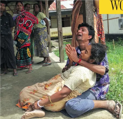  ?? WAI MOE / AFP / GETTY IMAGES ?? Relatives mourn for family members, whom they allege were killed by Rohingya militants in northern Myanmar, at Maungdaw hospital on Sunday. The victims, who were Hindu, were allegedly shot dead Saturday night.