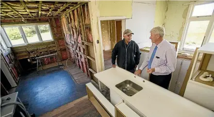  ?? WARWICK SMITH/STUFF ?? Merv Connelly, left, and Rangit¯ıkei mayor Andy Watson in a newly relocated home in Bulls, which is set to be renovated and sold to a first-home buyer in April.