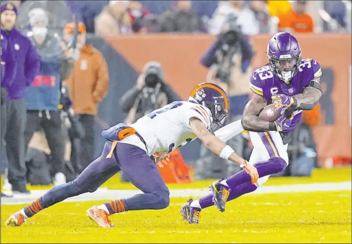  ?? Nam Y. Huh The Associated Press ?? Minnesota’s Dalvin Cook is tackled by Bears cornerback Teez Tabor on Monday, a night when Chicago played without all four starters in its secondary.