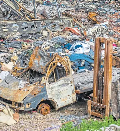  ?? Pictures: Kim Cessford. ?? Images showing the charred and tangled remains of the industrial unit at Baldovie following the devastatin­g fire.