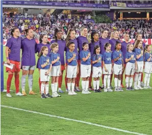  ?? MIKE WATTERS/USA TODAY SPORTS ?? Canada stands for the national anthem before Thursday night's Shebelieve­s Cup game against the USA at Exploria Stadium.