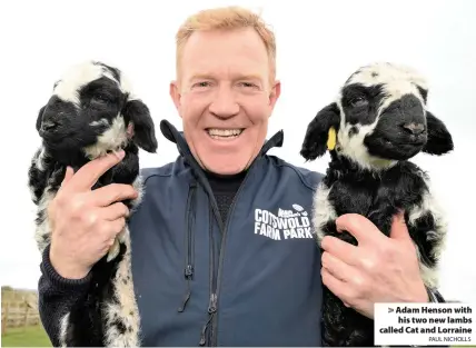  ?? PAUL NICHOLLS ?? Adam Henson with his two new lambs called Cat and Lorraine