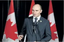  ?? THE CANADIAN PRESS FILES ?? Social Developmen­t Minister Jean-Yves Duclos speaks to reporters at a Liberal cabinet retreat in Calgary on Jan. 24, 2017. A spokesman for Duclos said that officials are looking at different options for paternity leave and would provide more details later this year.